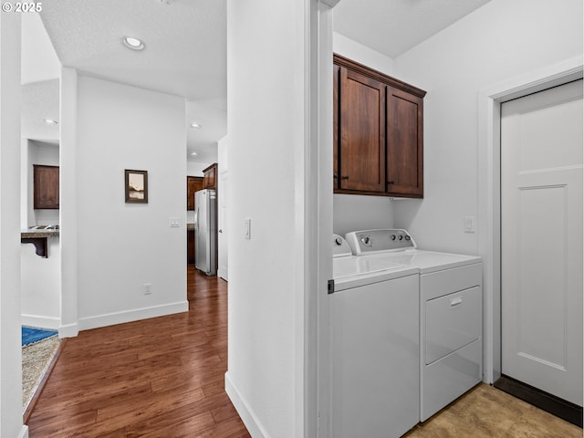 37149 Emerald Cascade, Sandy, OR 97055 - laundry room featuring cabinet space, washing machine and clothes dryer, light wood-style floors, and recessed lighting