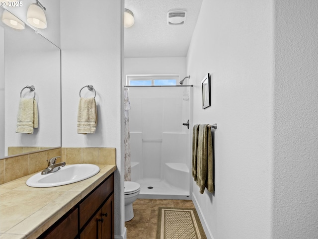 37149 Emerald Cascade, Sandy, OR 97055 - full bathroom featuring a stall shower, vanity, and a textured ceiling