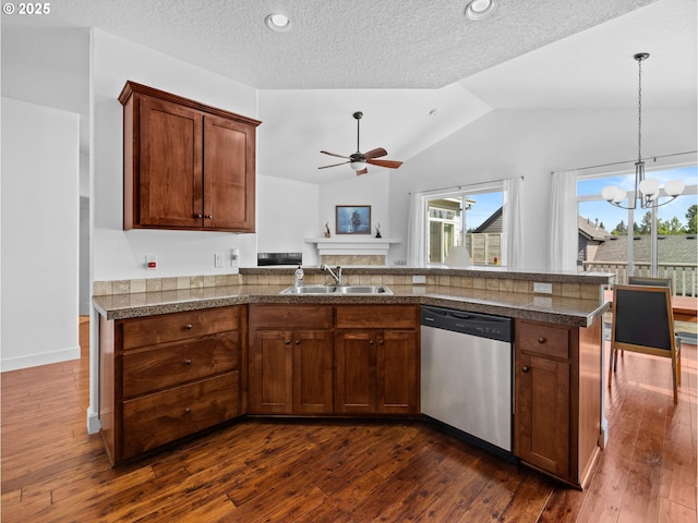 37149 Emerald Cascade, Sandy, OR 97055 - kitchen featuring stainless steel dishwasher, tile counters, lofted ceiling, ceiling fan, and a chandelier