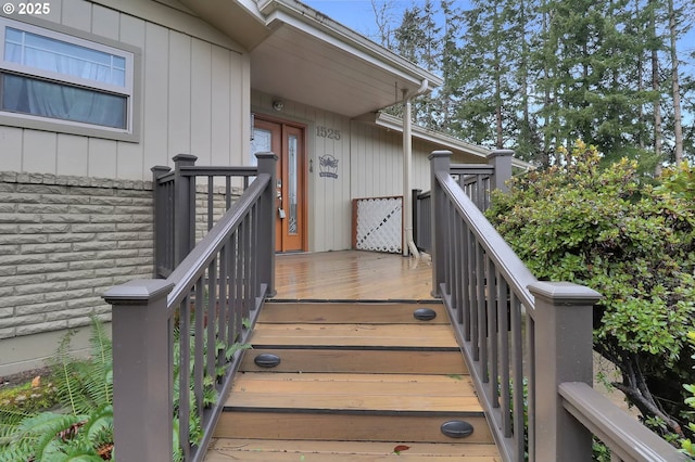 entrance to property with a deck