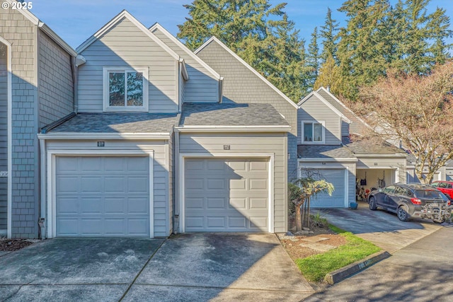 view of front of house featuring driveway and a shingled roof