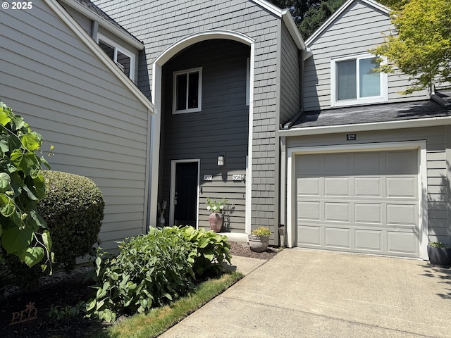 5225 Jean Rd Unit 307, Lake Oswego, OR 97035 - doorway to property featuring an attached garage and driveway
