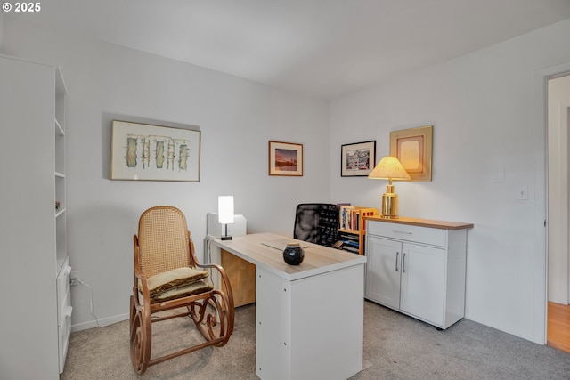 office space with light carpet and baseboards
