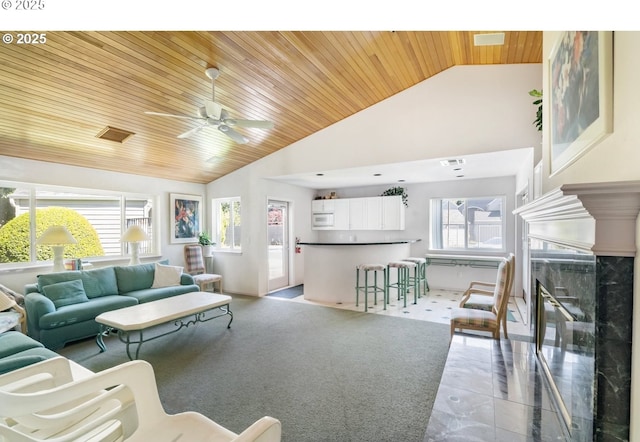 5225 Jean Rd Unit 307, Lake Oswego, OR 97035 - living room featuring wood ceiling, ceiling fan, a high end fireplace, high vaulted ceiling, and light tile patterned floors