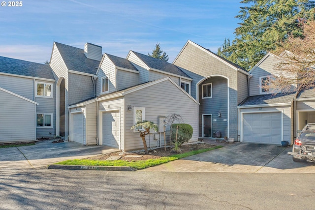 view of front of home featuring concrete driveway