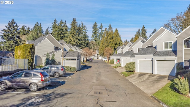 view of asphalt road featuring a residential view