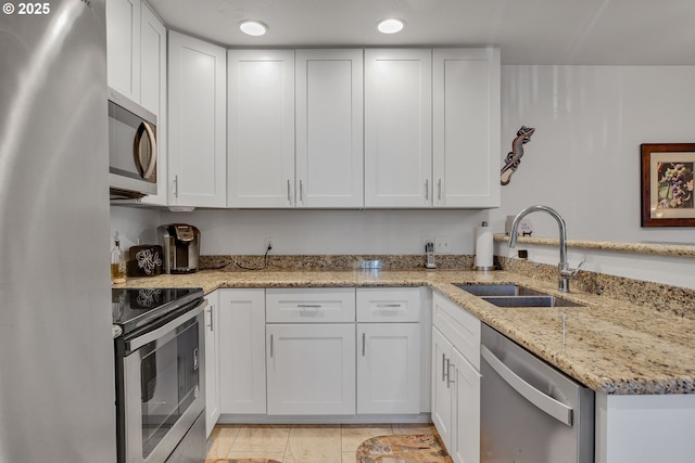 5225 Jean Rd Unit 307, Lake Oswego, OR 97035 - kitchen with appliances with stainless steel finishes, a sink, and white cabinets
