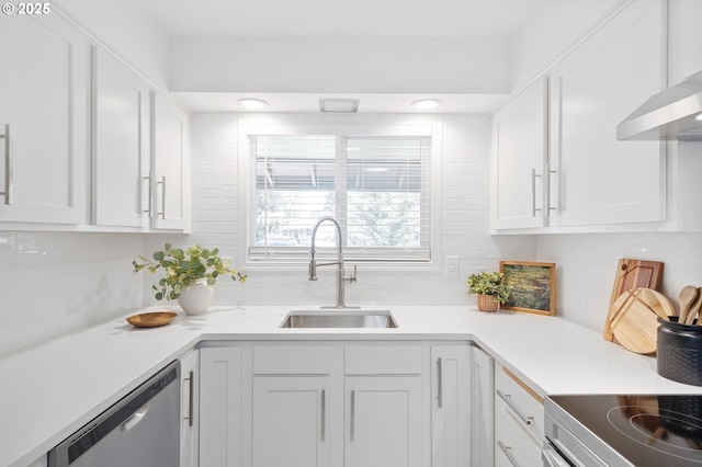 13440 SW Greenleaf Pl, Beaverton, OR 97005 - kitchen with a sink, stainless steel dishwasher, white cabinets, backsplash, and light countertops