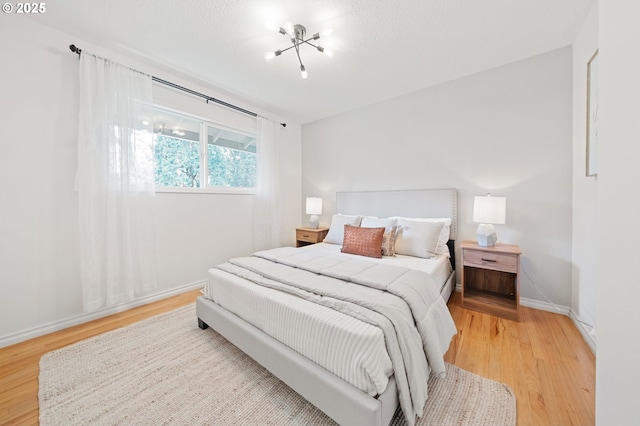 13440 SW Greenleaf Pl, Beaverton, OR 97005 - bedroom featuring light wood finished floors and baseboards