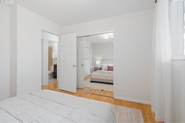 13440 SW Greenleaf Pl, Beaverton, OR 97005 - bedroom with wood finished floors and a closet