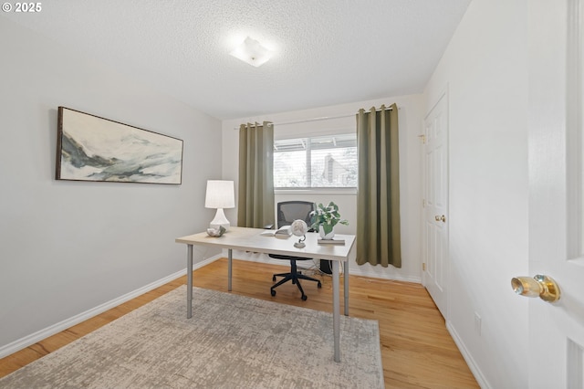 13440 SW Greenleaf Pl, Beaverton, OR 97005 - office area featuring light wood-type flooring, a textured ceiling, and baseboards
