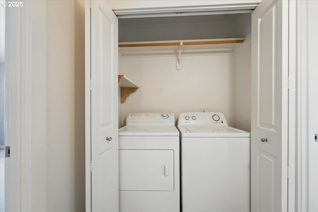 laundry area featuring washing machine and dryer