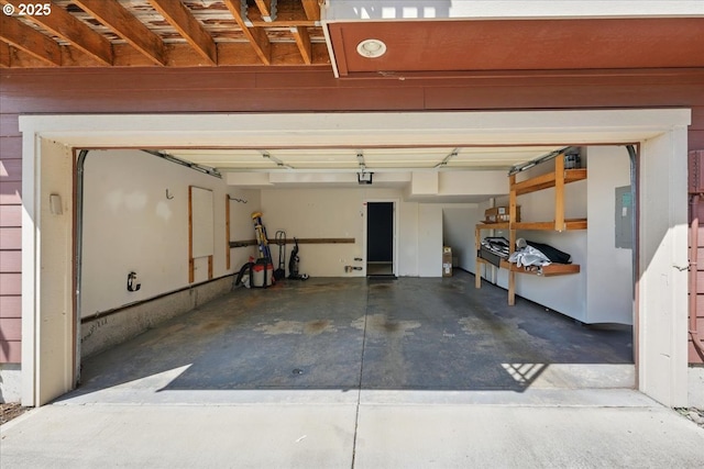 garage with electric panel and a garage door opener