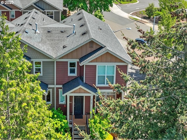 view of front of home featuring roof with shingles and board and batten siding