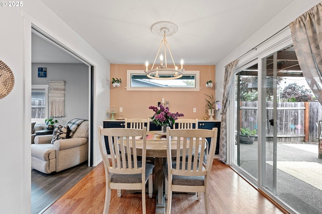 dining room featuring an inviting chandelier and wood finished floors