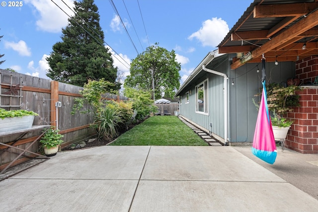 view of yard featuring a fenced backyard and a patio area