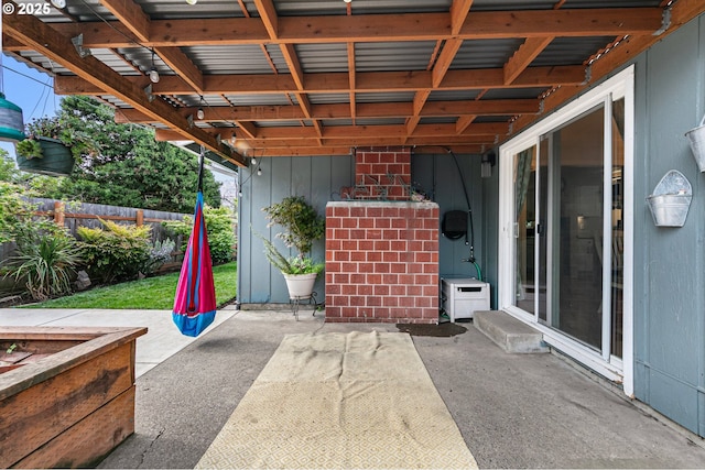 view of patio / terrace featuring fence