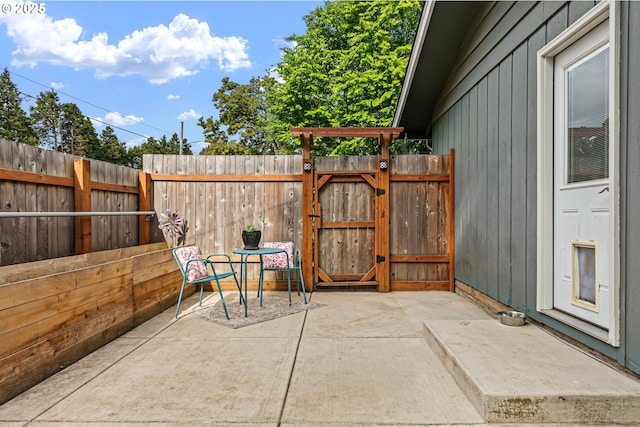 view of patio featuring fence