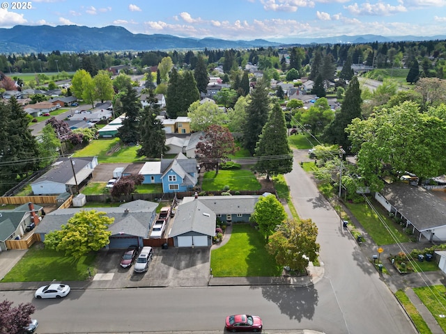 drone / aerial view featuring a residential view and a mountain view