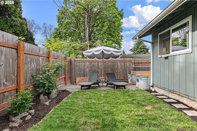 view of yard with a fenced backyard