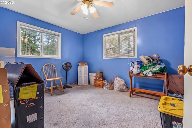 recreation room featuring carpet floors and a ceiling fan