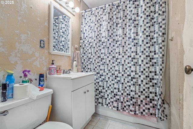 bathroom with toilet, tile patterned flooring, and vanity