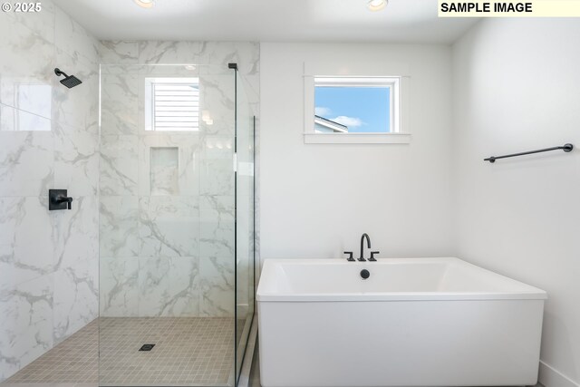 bathroom featuring separate shower and tub