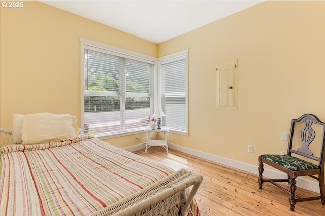 1537 NW 21st St, Lincoln City, OR 97367 - bedroom featuring electric panel, baseboards, and light wood finished floors