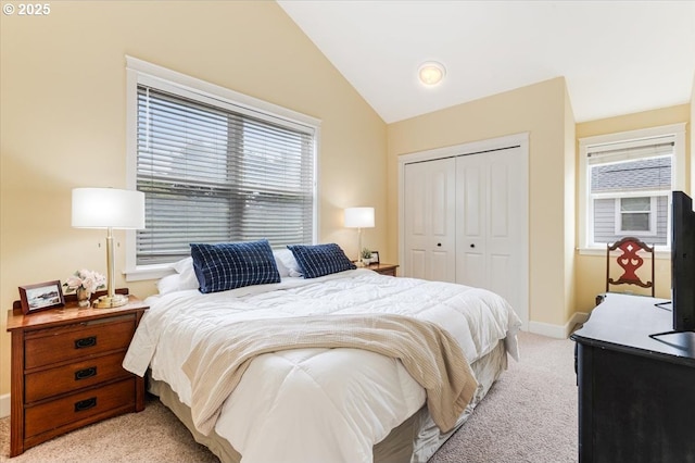 1537 NW 21st St, Lincoln City, OR 97367 - bedroom featuring light colored carpet, a closet, vaulted ceiling, and baseboards