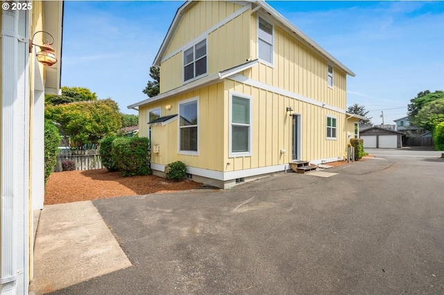 1537 NW 21st St, Lincoln City, OR 97367 - view of front of home with an outbuilding, board and batten siding, and entry steps