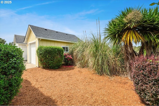 1537 NW 21st St, Lincoln City, OR 97367 - view of property exterior with a shingled roof and an attached garage
