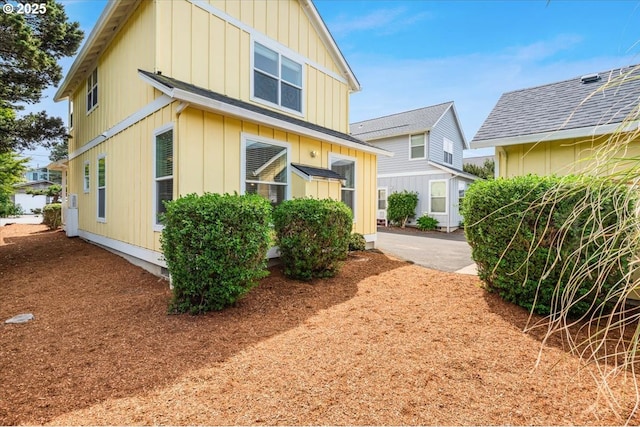 1537 NW 21st St, Lincoln City, OR 97367 - view of side of property featuring board and batten siding
