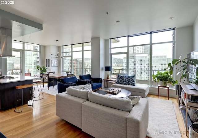 949 NW Overton St Unit 1302, Portland, OR 97209 - living room featuring light wood-type flooring and a wall of windows