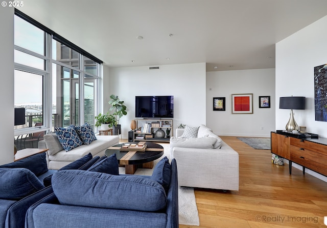 949 NW Overton St Unit 1302, Portland, OR 97209 - living area featuring light wood-type flooring and baseboards