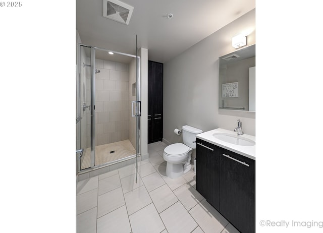949 NW Overton St Unit 1302, Portland, OR 97209 - full bathroom featuring vanity, a stall shower, and tile patterned floors