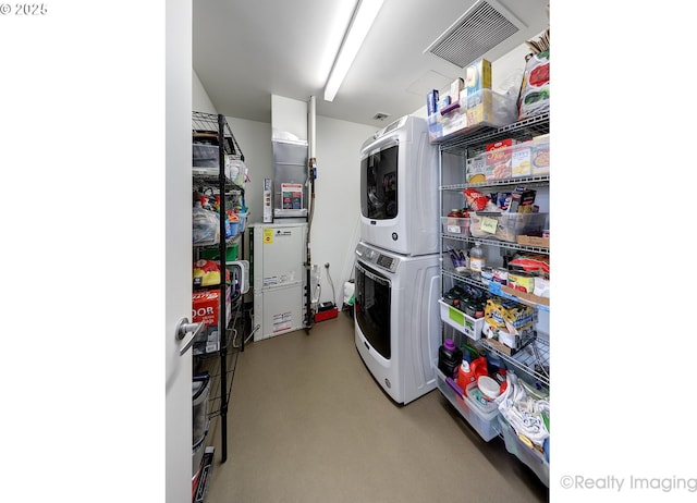 949 NW Overton St Unit 1302, Portland, OR 97209 - washroom featuring stacked washer and clothes dryer