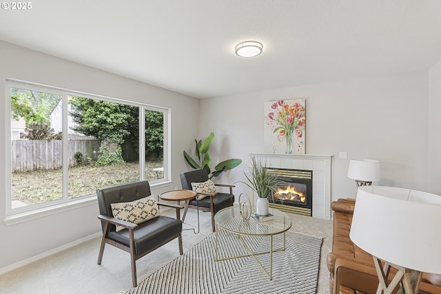 1974 SE 60th Ave, Hillsboro, OR 97123 - living area featuring a tiled fireplace, carpet, and baseboards