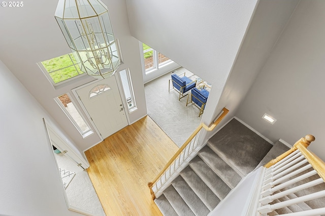 1974 SE 60th Ave, Hillsboro, OR 97123 - foyer entrance with a chandelier, a towering ceiling, wood finished floors, and stairway