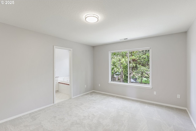 1974 SE 60th Ave, Hillsboro, OR 97123 - empty room featuring carpet floors, baseboards, and a textured ceiling