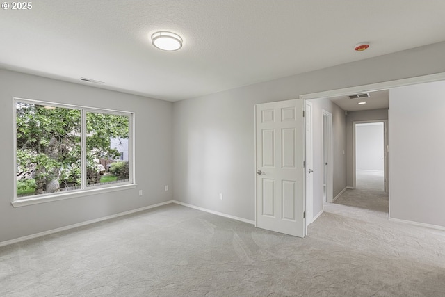 1974 SE 60th Ave, Hillsboro, OR 97123 - carpeted spare room featuring baseboards