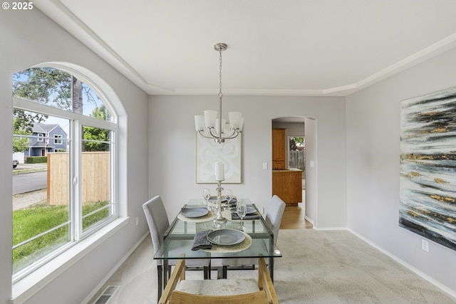 1974 SE 60th Ave, Hillsboro, OR 97123 - dining area featuring a chandelier, plenty of natural light, arched walkways, and baseboards