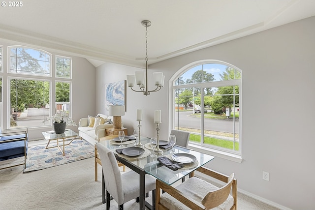 1974 SE 60th Ave, Hillsboro, OR 97123 - carpeted dining space featuring healthy amount of natural light, a chandelier, and baseboards