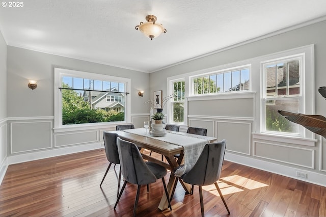 1902 N Terry St, Portland, OR 97217 - dining space with a decorative wall, hardwood / wood-style floors, healthy amount of natural light, ornamental molding, and a wainscoted wall