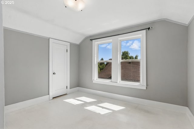 1902 N Terry St, Portland, OR 97217 - unfurnished bedroom with vaulted ceiling, a closet, and baseboards