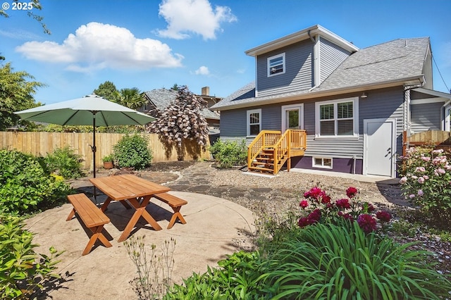 1902 N Terry St, Portland, OR 97217 - back of house featuring a patio area, roof with shingles, and outdoor dining area