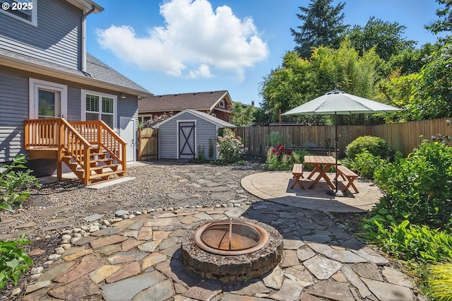 1902 N Terry St, Portland, OR 97217 - fenced backyard with an outdoor fire pit, a patio area, and outdoor dining space