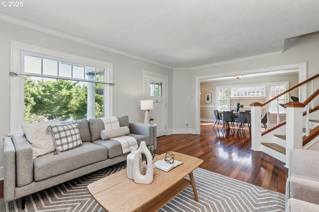 1902 N Terry St, Portland, OR 97217 - living room featuring hardwood / wood-style floors, stairs, ornamental molding, and baseboards