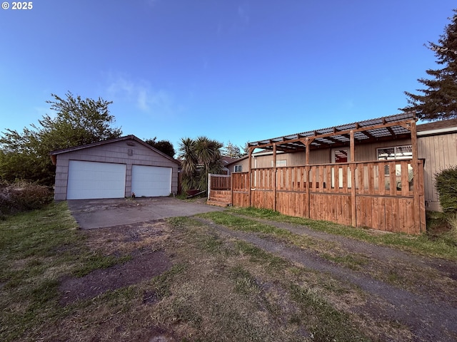 exterior space featuring an outdoor structure and a detached garage