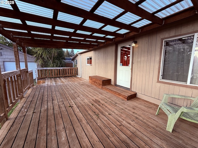 wooden deck featuring a pergola