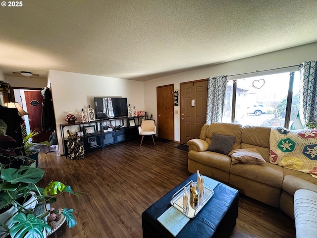 living room with dark wood finished floors and a textured ceiling